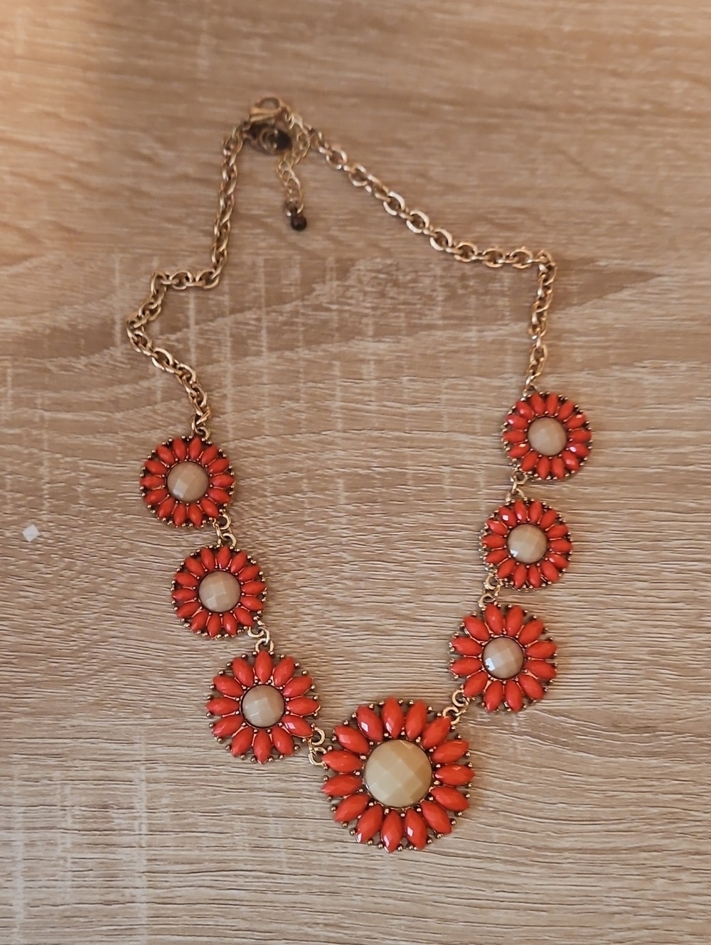 Charming Charlie Gold-Tone Necklace with Orange and Cream Floral Discs